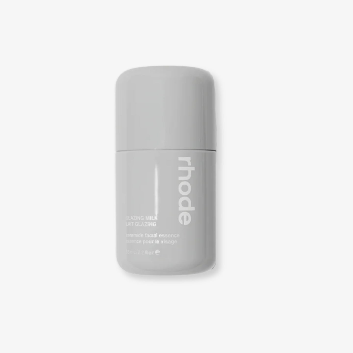 Gray bottle with 'rhode' branding on a white background