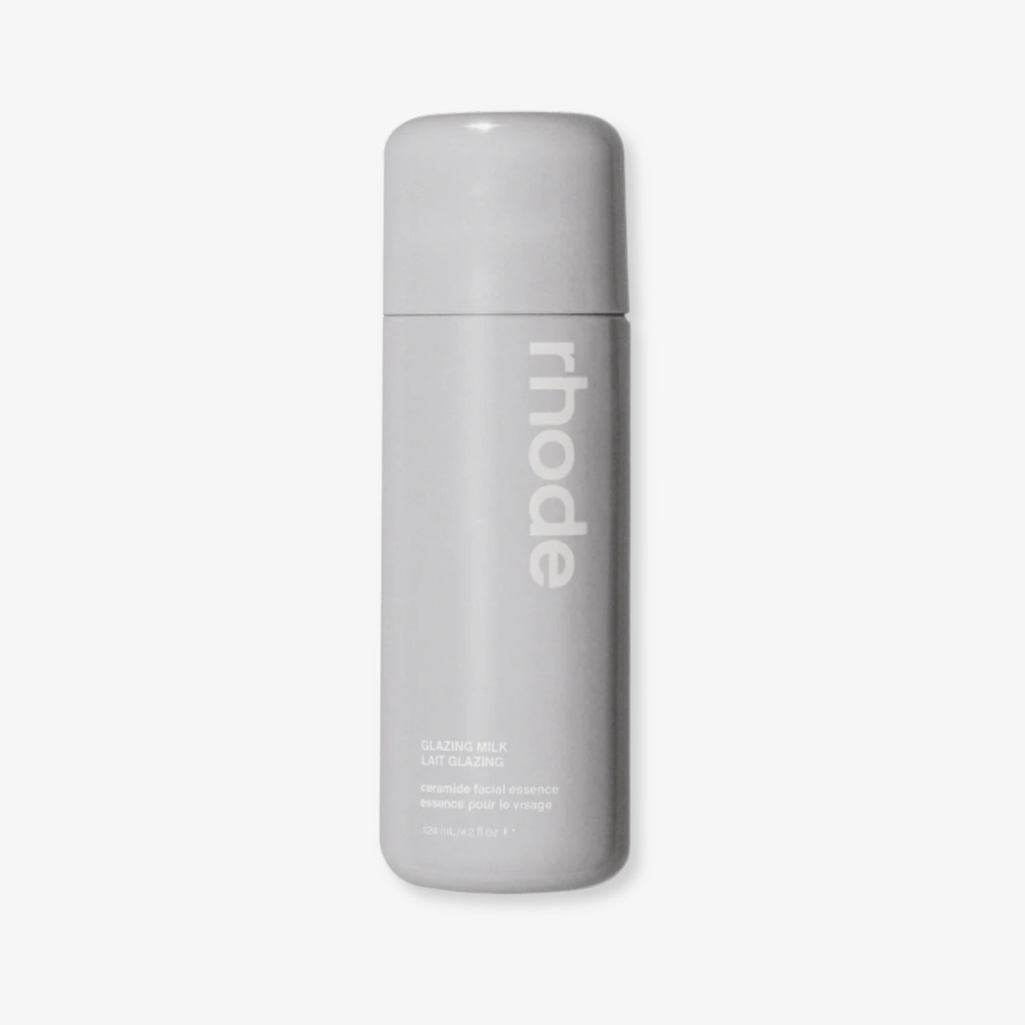 Gray bottle with 'rhode' branding on a light gray background