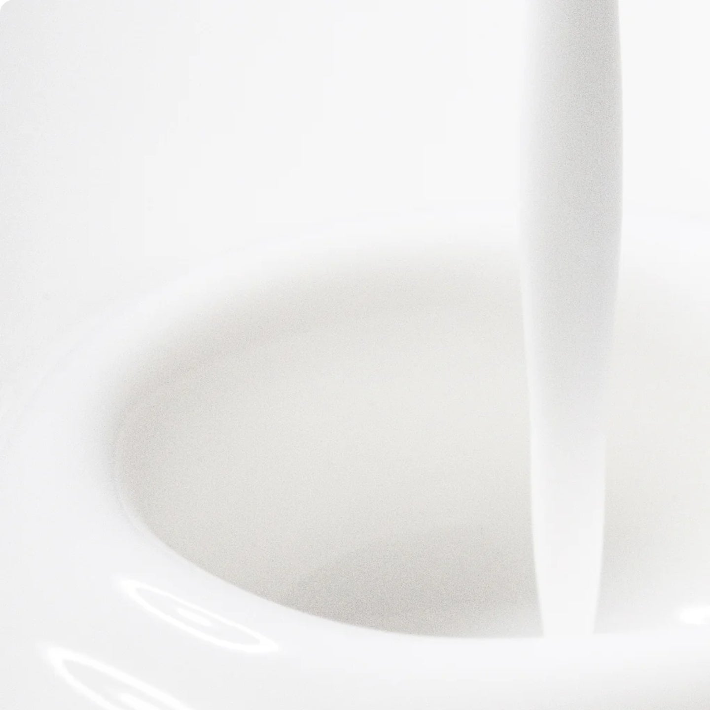 Close-up of a white ceramic bowl with a smooth surface