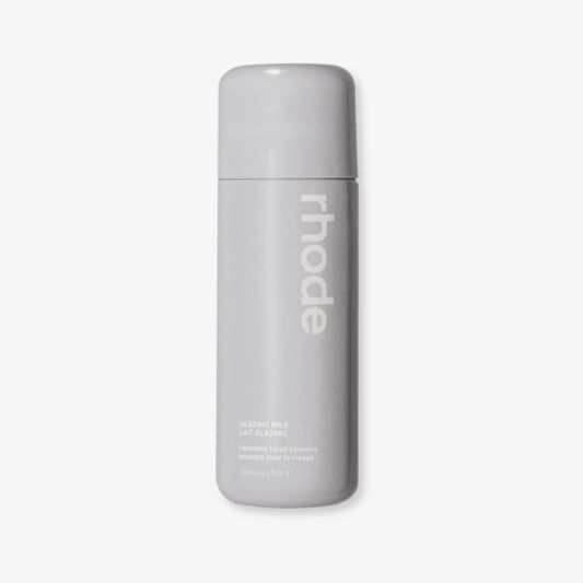 Gray bottle with 'rhode' branding on a light gray background