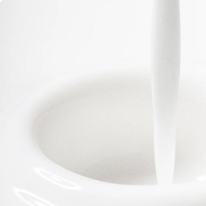 Close-up of a white ceramic bowl with a smooth surface