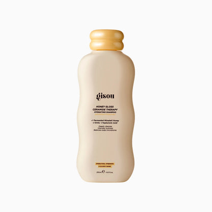 Shampoo bottle with a beige cap on a white background