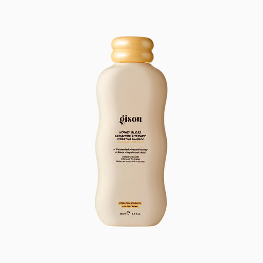 Shampoo bottle with a beige cap on a white background